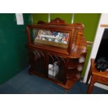 A Victorian style mahogany display cabinet sideboard, with a shaped back, glazed case, containing