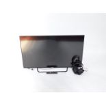 A Sony Bravia 49" flat screen television, serial no 6820628, with remote, and headphones.