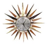 A 1970's Metamec light beech and brass sunburst wall clock, circular silvered dial bearing Arabic