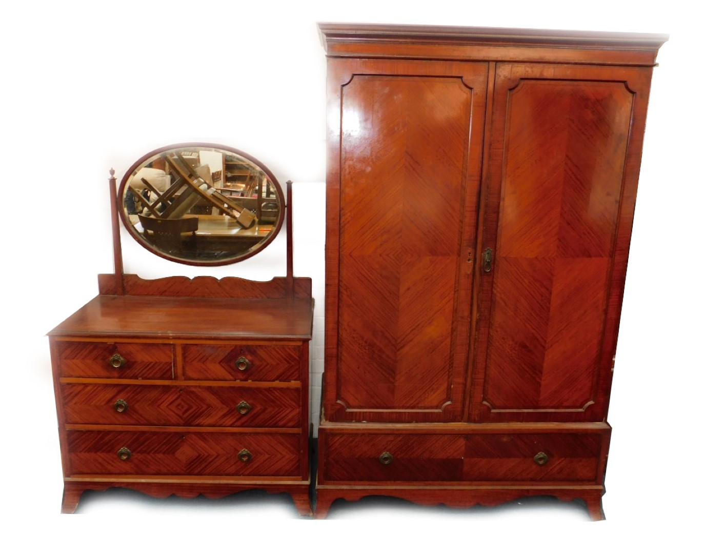 A Maple & Company mahogany double wardrobe, with quartered and herringbone veneers, the outswept