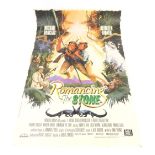 A large film poster for Romancing The Stone, starring Michael Douglas and Kathleen Turner, 20thC