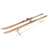 A pair of Resko early 20thC Elite skis, together with a pair of Touring ski poles. (4)