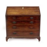 A George III mahogany bureau, with fall flap resting on lopers, revealing fitted interior of