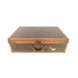 A Louis Vuitton cabin trunk, early 20thC with monogrammed brown canvas, monogrammed tan edge and