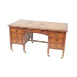 A Victorian oak twin pedestal desk, with a tooled brown leather top, over one central drawer flanked