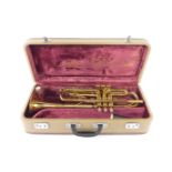 A Melody Maker brass trumpet, cased.