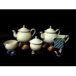 Two Carltonware lustre pottery 'Walking' teapots, sugar basin and cover, 'Happy Birthday' milk