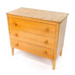 A Gordon Russell 1950's walnut and beech chest of drawers, with three drawers raised on tapering