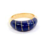 An 18ct gold and Lapis lazuli ring, of domed form, size Q, 5.3g.