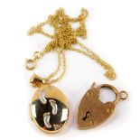 A 9ct gold oval photo locket on chain, together with a 9ct gold heart shaped padlock clasp, 3.9g.