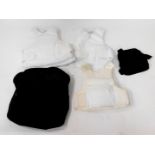 Three white military issue bullet proof vests.