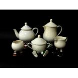 A Carltonware lustre pottery teapot, hot water jug, milk jug and two sugar basins, one seated with a