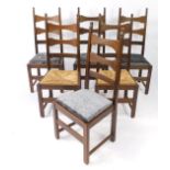 A set of six oak ladder back dining chairs, four with drop-in seats, two rush seated.