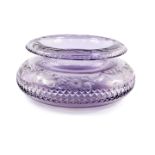 An early 20thC amethyst glass bowl, with an everted rim, engraved with bands and swags of flowers,