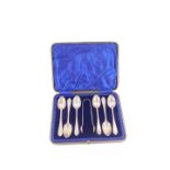 A set of six Edward VII silver teaspoons, and a pair of sugar tongs, with bright cut engraving,
