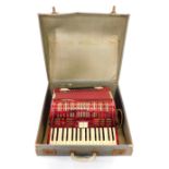 A Soprani Di Silvio Recanatti piano accordian, red cased with cracked ice finish, 48 button.