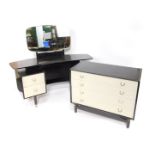 A G-Plan black and cream painted 1950's wooden chest of drawers, with four long drawers raised on