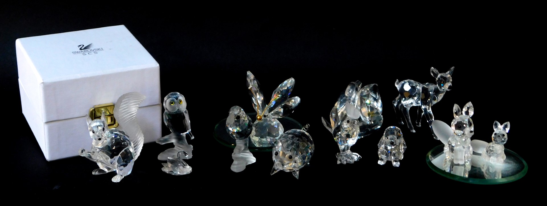 A Swarovski Crystal Squirrel, with box, fawn with box, fox and cub, pig, butterfly, swan and cygnet,