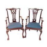 A set of eight early 20thC Chippendale style mahogany dining chairs, with leaf carved crest rail,