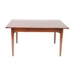 A French fruitwood country style kitchen table, the four and half plank top raised on tapering