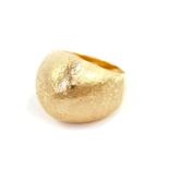 A lady's 14ct gold dress ring, in a domed and textured design, size R, 9.9g.