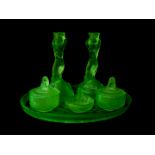 An Art Deco green frosted glass dressing table set, decorated with mermaids, comprising oval tray,