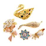 Five Swarovski crystal brooches, comprising a swan, furled leaf, floral spray, flower head and a