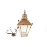 A Victorian copper and glass panelled lantern, with a cast iron pillar support, 36cm W, 108cm H.