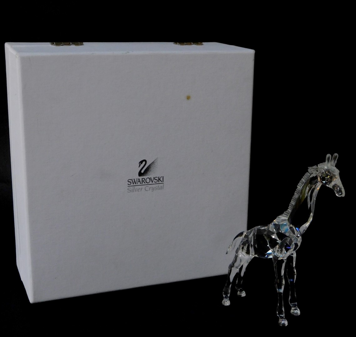 A Swarovski Crystal standing giraffe, with box.