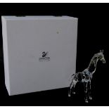 A Swarovski Crystal standing giraffe, with box.