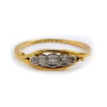 An 18ct gold platinum and diamond five stone ring, approx 0.2cts, size M, 1.8g.