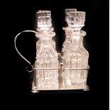 An Edward VII silver and cut glass four bottle cruet, Birmingham 1909, 5.29oz.