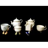 Two Carltonware lustre pottery 'Walking' teapots, sugar basin with cover, a pirate mug and