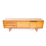 A late 20thC teak sideboard by White & Newton Ltd Portsmouth, the central fall flap flanked by three