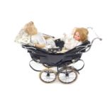 A Silver Cross pram, on a sprung chassis, 94cm L, together with three dolls.