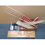 A President Flyboy balsa wood kit glider, part built, together with box, motor and remote control.