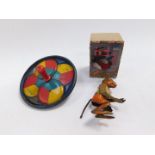 An early 20thC German tin plate clock work figure of a monkey, Continental wind-up toy modelled as