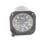 A Winter Instruments aircraft altometer, model no 4 FGH 10, black dial with white loomed numbers,
