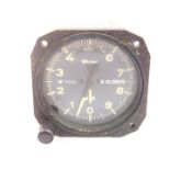 A Winter Instruments aircraft altometer, model no 4 FGH 10, black dial with white loomed numbers,