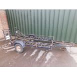 A metal framed car trailer, for golf buggy or ride-on lawn mower, 257cm x 160cm.