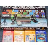 An Atari Video Computer System, Model No CX2600, boxed, together with four games, comprising Space