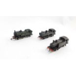 Three kit built OO gauge shunting engines, Great Western, British Rail, and LNER liveries, in a