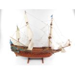 A 20thC wooden scale model of The Swedish 17thC Warship Vasa, scale 1:75, on a wooden stand, 107cm