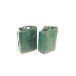 Two military Jerry cans, both painted green, one dated 1953, the other 1967.