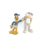 A rubber toy figure of Donald Duck, modelled standing with a waving left arm, 49cm H, together