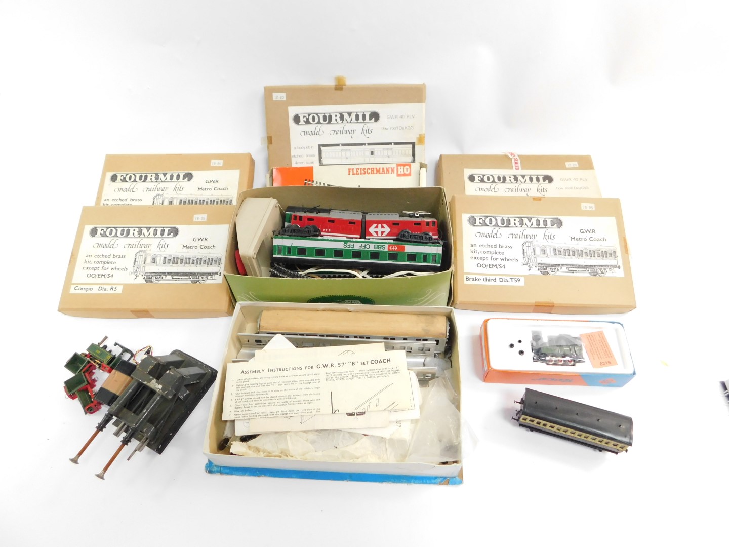 Five Fourmil model railway kit coaches, unmade, boxed, Roco HO Little E gauge tank locomotive,