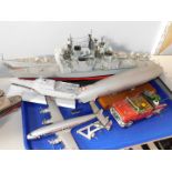 A model of The USS Ticonderoga, further American warship, Hindenburg airship, helicopter carrier,