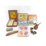 Games and toys, including a Tri-Ang Wakoua Dog, Happy Families, World Tours, and Tell Me. (qty)