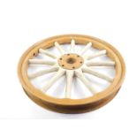 A Model T Ford wheel, painted brown with white spokes, 61cm Dia.