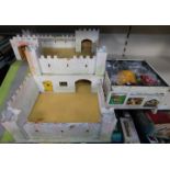 A model wooden fort, together with Britains metal and plastic knights in armour, Roman figures, etc.